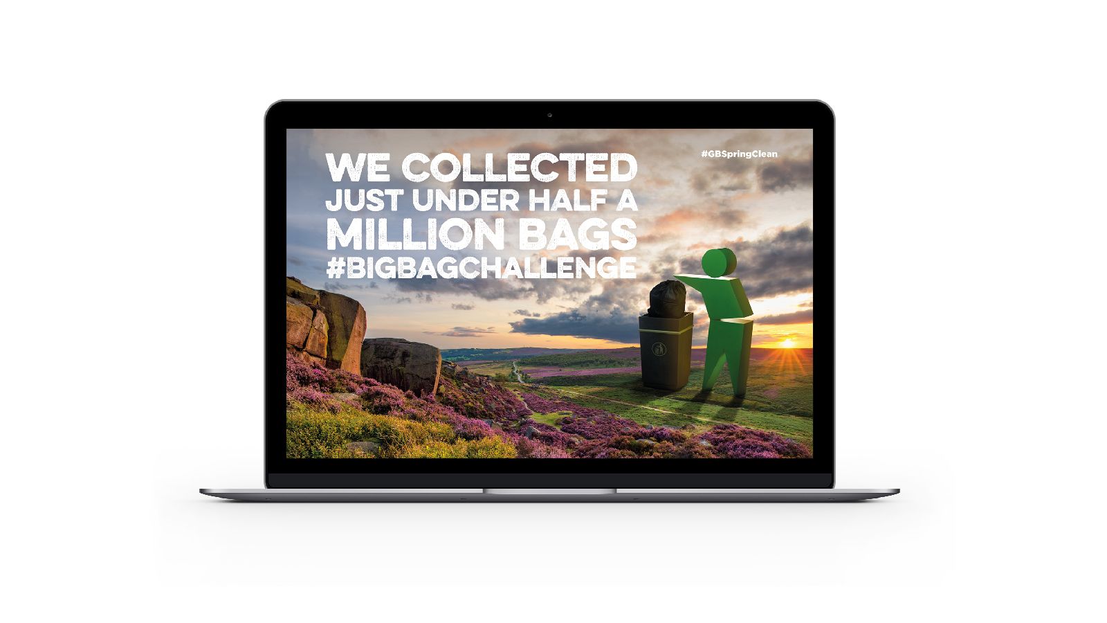 A laptop screen with the words 'We collected just under half a million bags #bigbagchallenge' on it.
